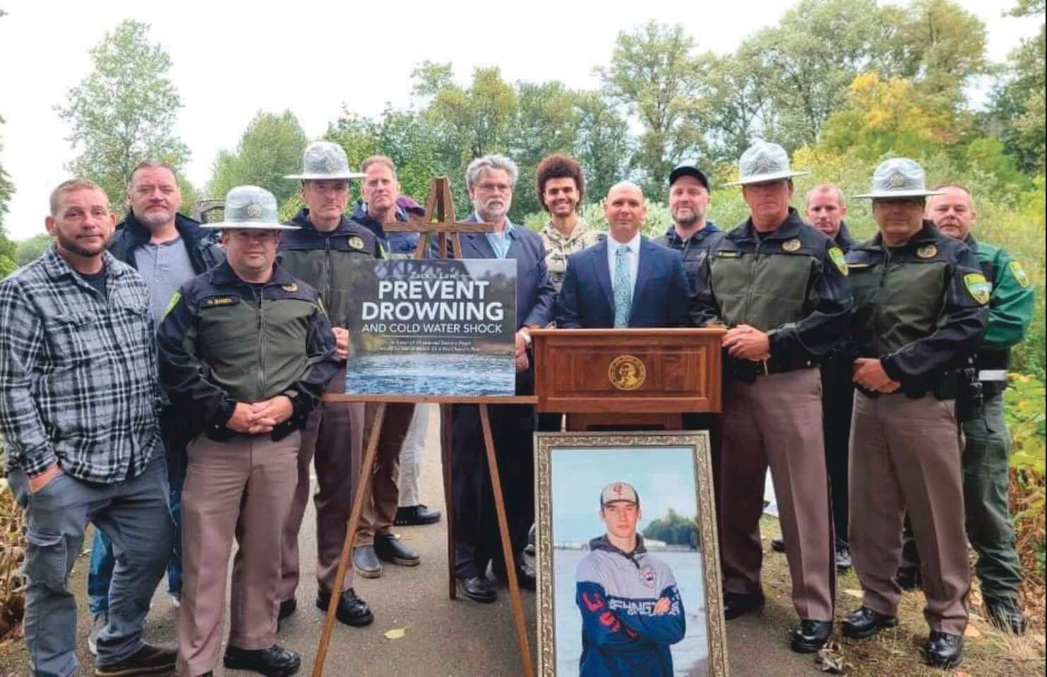 Community leaders, law enforcement and family of Zachary Rager pose for a photo along the Willapa Hills Trail during an event last September raising awareness around cold water shock to prevent drownings.